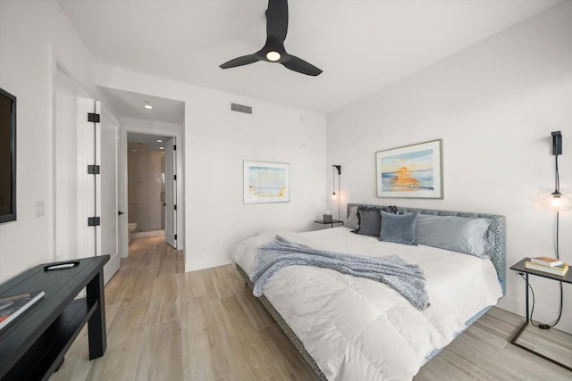 bedroom with ceiling fan and light hardwood / wood-style floors