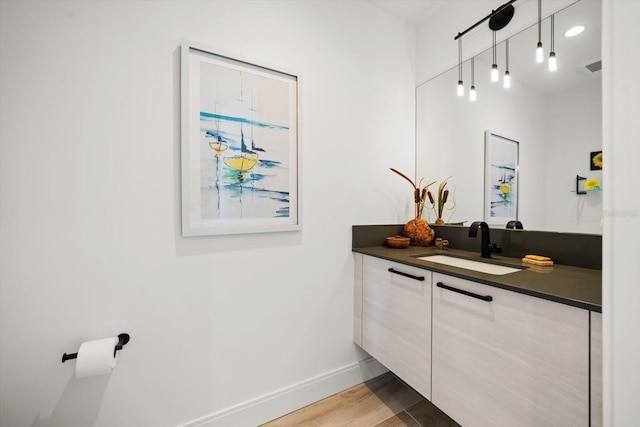 bathroom featuring vanity and wood-type flooring