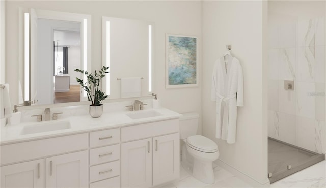 bathroom featuring vanity, toilet, and a tile shower