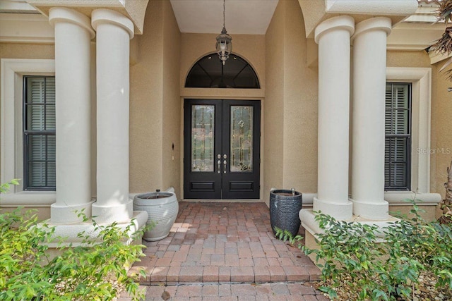 entrance to property featuring french doors