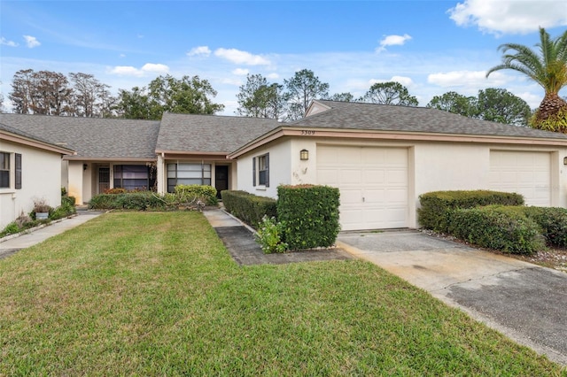 ranch-style home featuring a garage and a front lawn