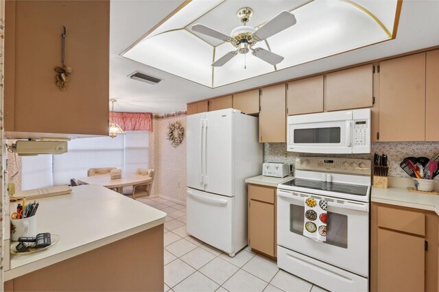 kitchen featuring kitchen peninsula, tasteful backsplash, white appliances, ceiling fan, and light tile patterned flooring