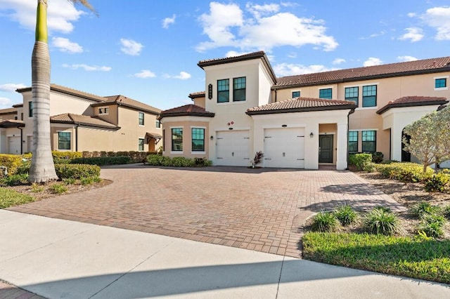 mediterranean / spanish house with a garage