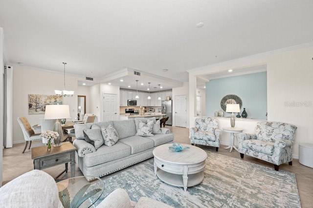 living room with light tile patterned flooring, crown molding, and an inviting chandelier