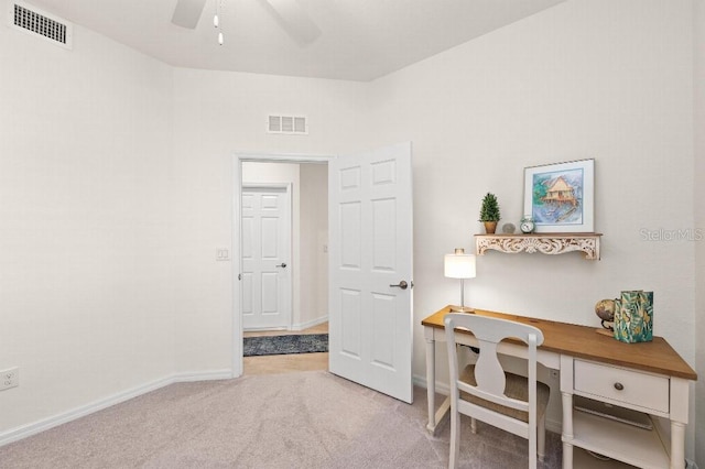 home office featuring light colored carpet and ceiling fan