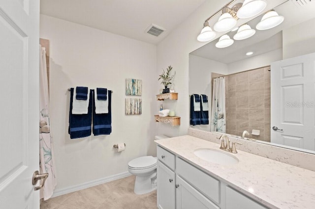 bathroom featuring a shower with curtain, vanity, toilet, and tile patterned floors