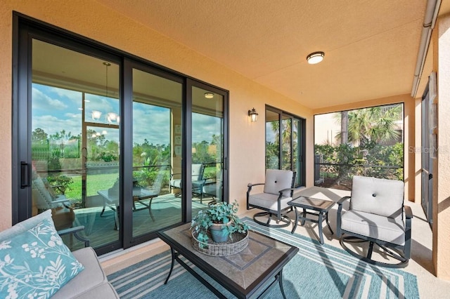 sunroom / solarium featuring plenty of natural light