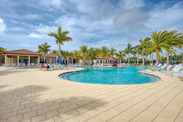 view of swimming pool with a patio area