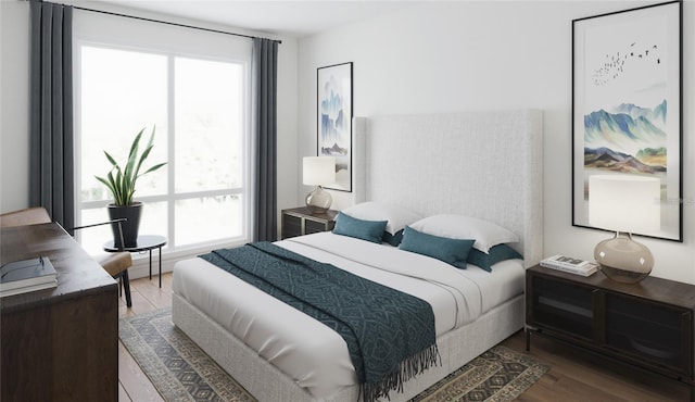 bedroom featuring hardwood / wood-style flooring and multiple windows