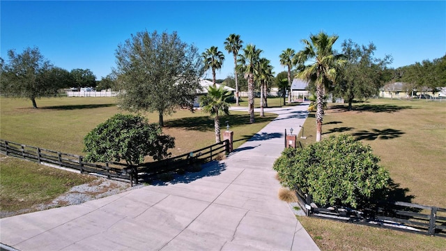 view of property's community featuring a lawn