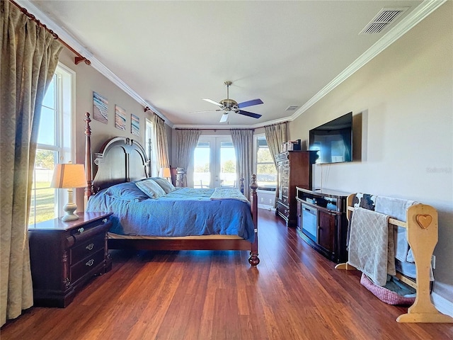 bedroom featuring dark wood-type flooring, ceiling fan, and crown molding