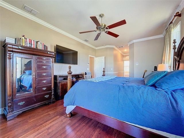 bedroom featuring ceiling fan, hardwood / wood-style floors, and ornamental molding