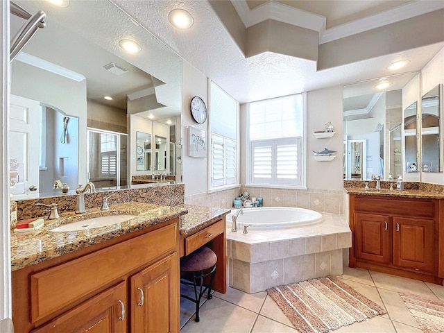 bathroom with crown molding, tile patterned flooring, vanity, and shower with separate bathtub