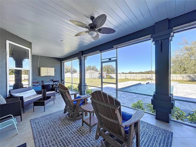 sunroom / solarium with ceiling fan