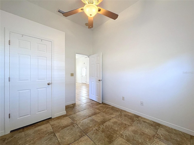 unfurnished bedroom with a closet and ceiling fan