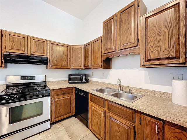 kitchen featuring sink, light tile patterned flooring, and black appliances