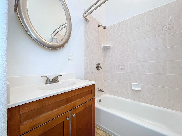 bathroom with vanity and tiled shower / bath combo