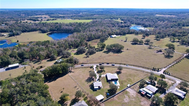 aerial view with a rural view and a water view