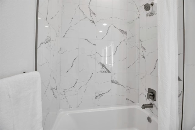bathroom with shower / bath combination with curtain