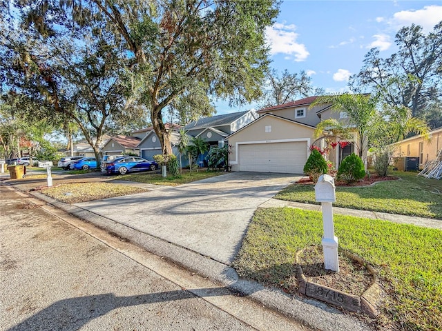 view of front of house featuring a front yard and a garage