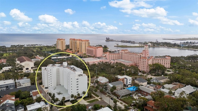 drone / aerial view featuring a water view and a city view