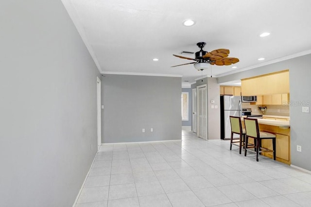 living room featuring ceiling fan and ornamental molding