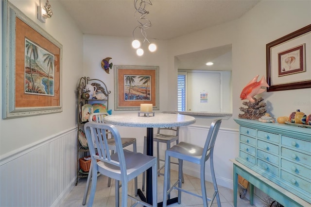 dining area with light tile patterned floors