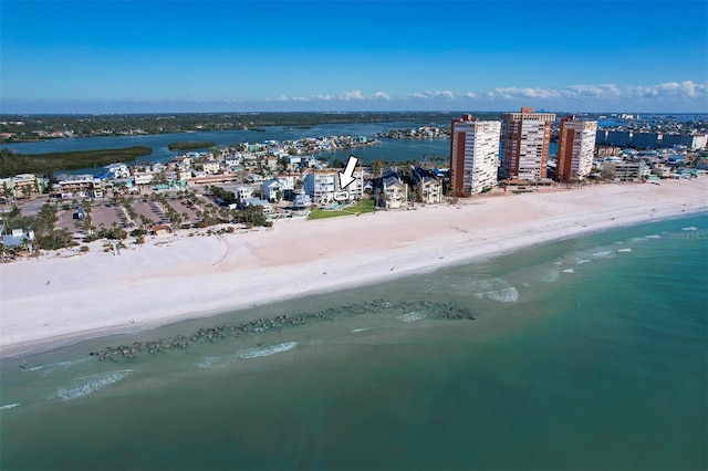 drone / aerial view with a water view and a beach view