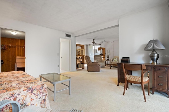 living room with ceiling fan and light colored carpet