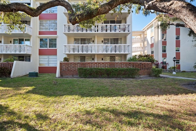 view of building exterior with central AC unit