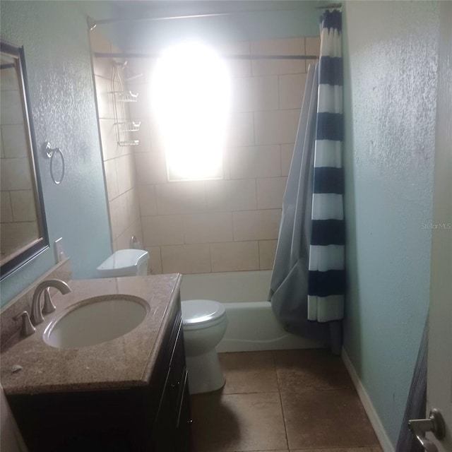 full bathroom featuring toilet, shower / bath combination with curtain, vanity, and tile patterned floors