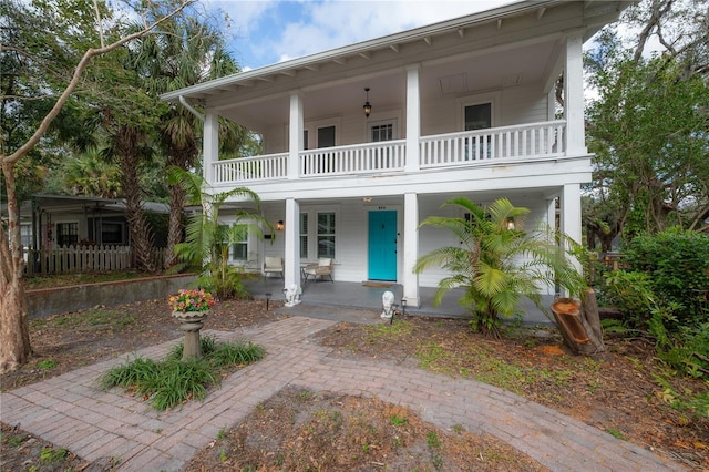 view of front of home with a balcony