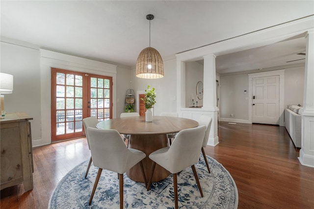 dining space featuring ornamental molding, french doors, and dark hardwood / wood-style floors