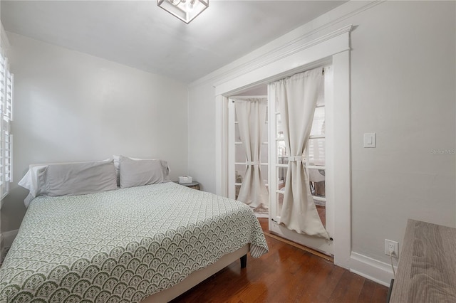 bedroom with hardwood / wood-style flooring