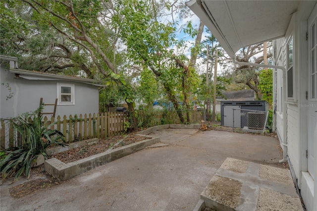 view of patio featuring a storage shed