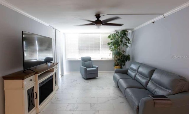 living room with ceiling fan and ornamental molding