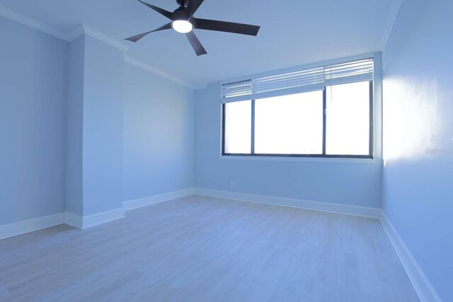 unfurnished room with ceiling fan, crown molding, and light hardwood / wood-style floors