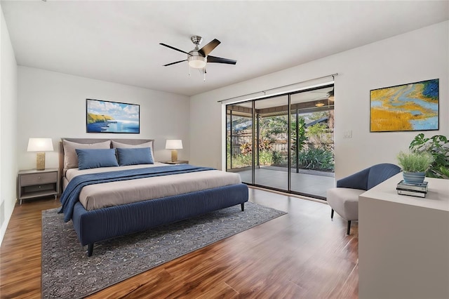 bedroom with dark wood-type flooring, access to outside, and ceiling fan