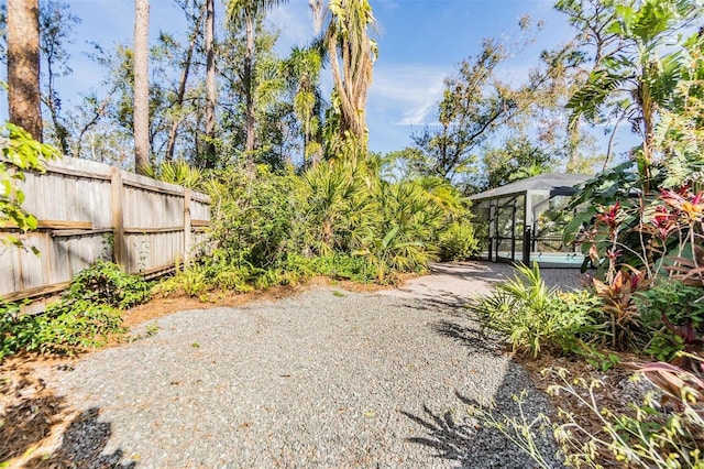 view of yard with a lanai