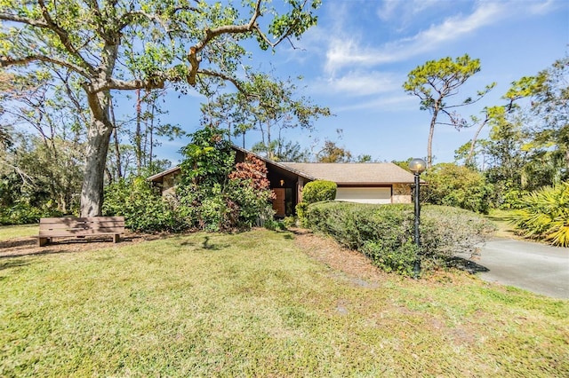 exterior space with a garage and a front yard