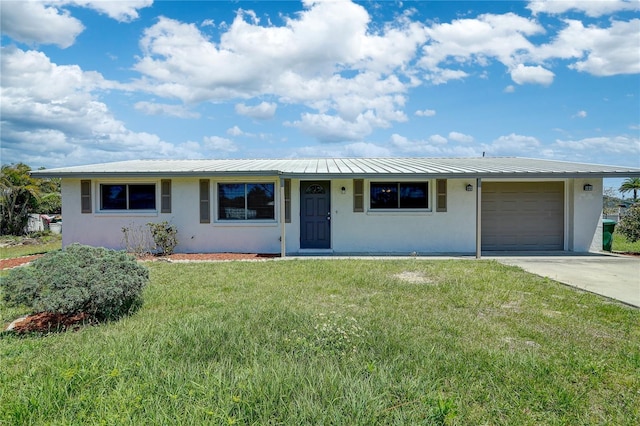 ranch-style house with a garage and a front lawn