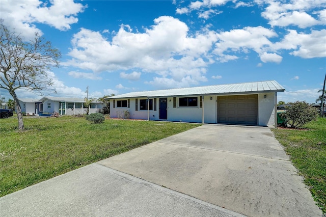 ranch-style home with a front lawn and a garage