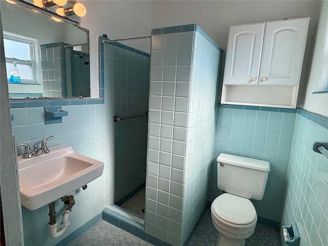 bathroom featuring tile patterned flooring, toilet, tile walls, and walk in shower