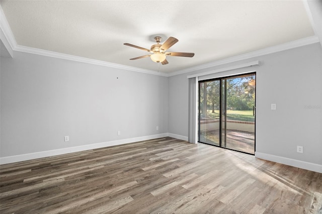 unfurnished room featuring ceiling fan, ornamental molding, and hardwood / wood-style floors