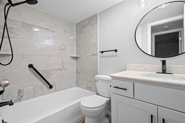 full bathroom featuring toilet, vanity, and tiled shower / bath