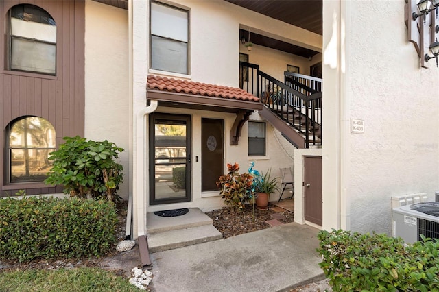 doorway to property featuring central AC