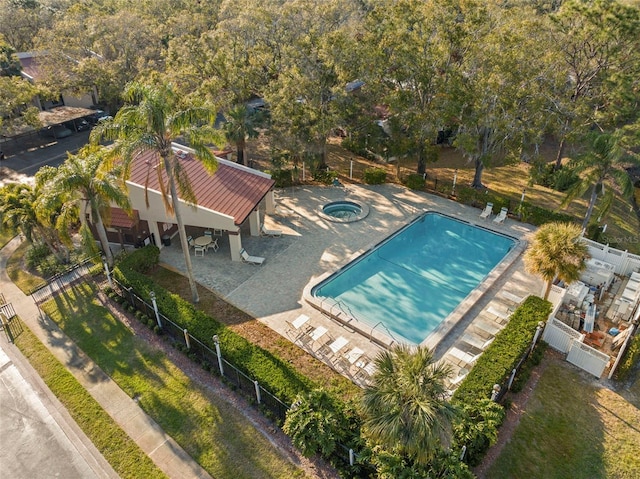 view of pool featuring a hot tub and a patio