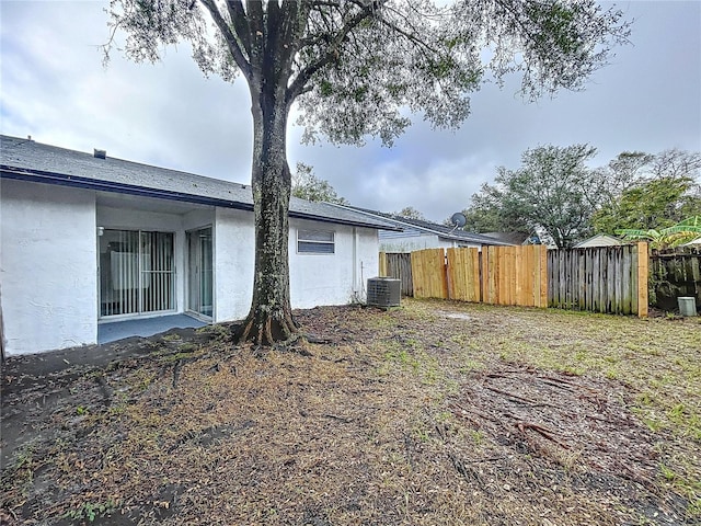 view of yard with central AC