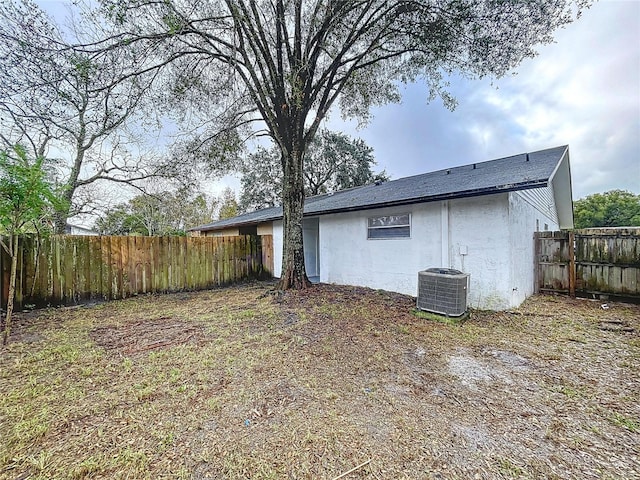 back of property with central air condition unit