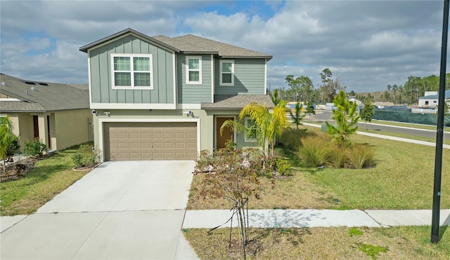 view of front of home with a garage and a front lawn